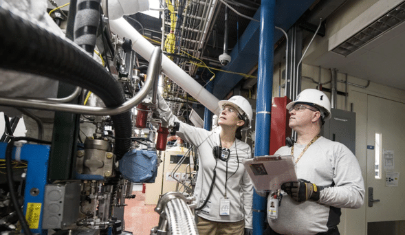 Engineers Checking On An Industrial System