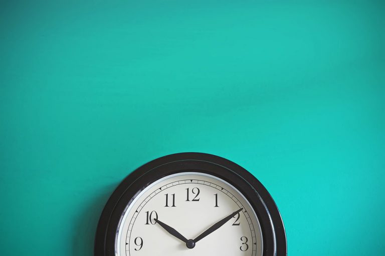 Clock On a Wall Showing Ten After Ten; Visual for Time Fraud