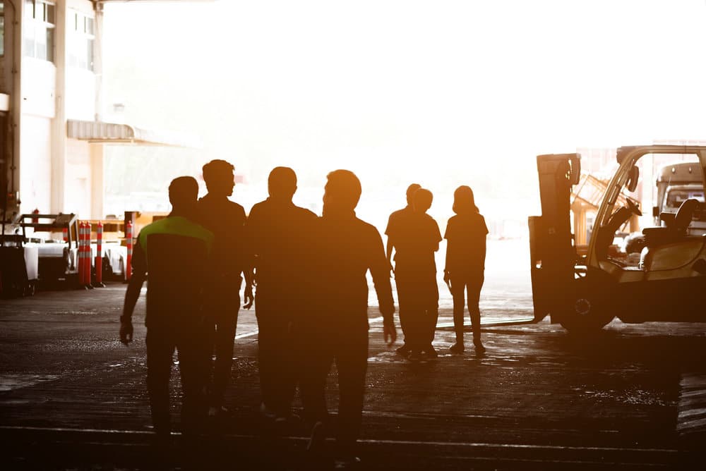 Employees Talking Together On The Job Site