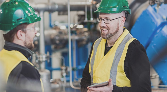 Two Industrial Workers Having a Conversation