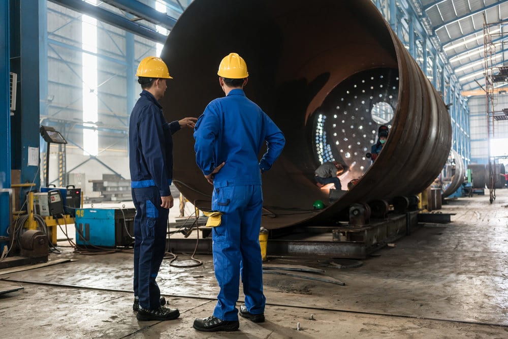 Manufacturing Workers Assembling a Tunnel