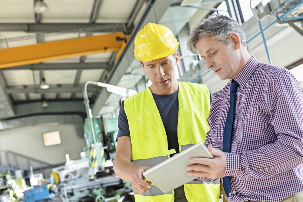 A Boss Showing His Employee A Shift Schedule