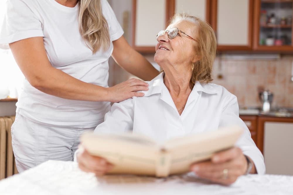 Younger Woman Taking Care Of An Older Woman