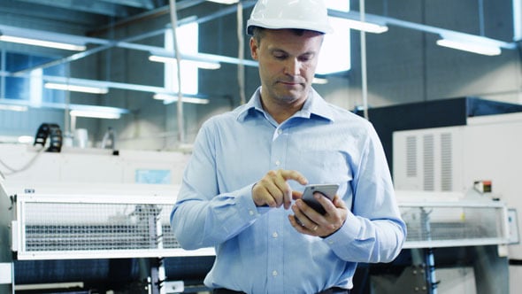 Engineer Checking His Schedule On An App