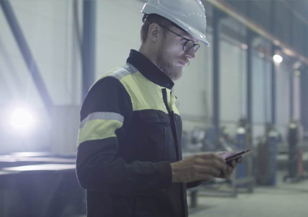 Industrial Worker Checking His Phone