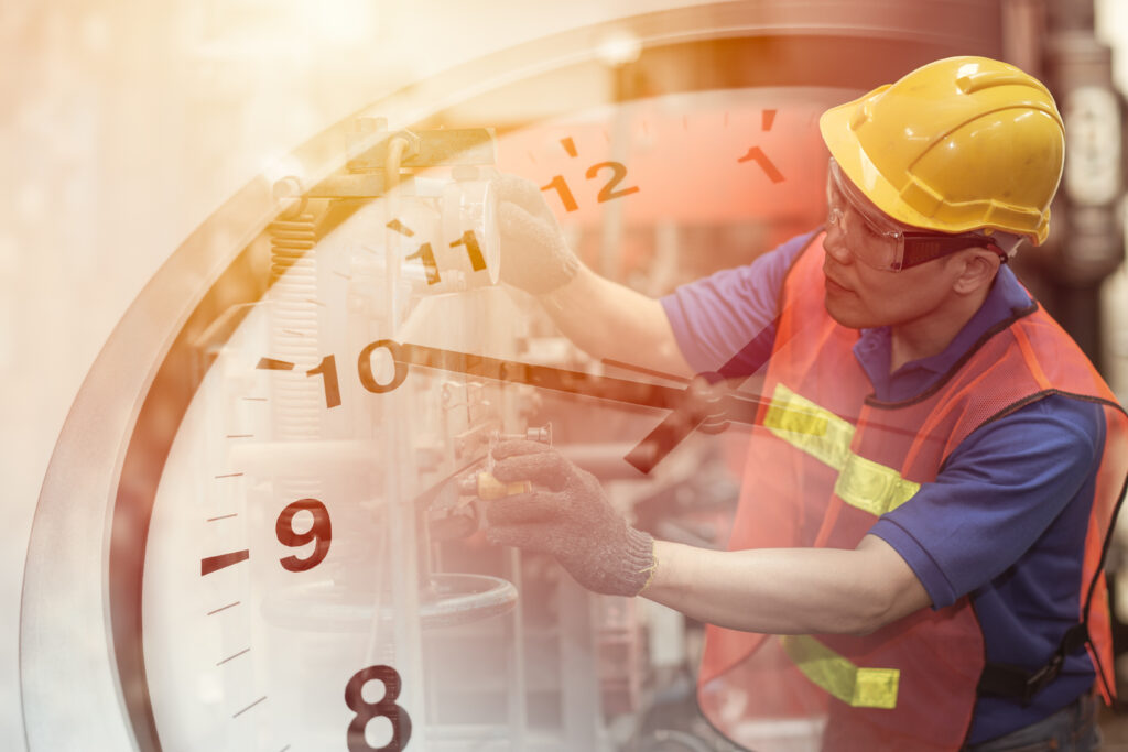 Industrial Technician And Clock in Background