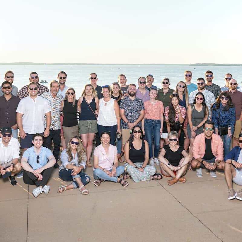 Indeavor Employee Group Picture in Front of a Lake