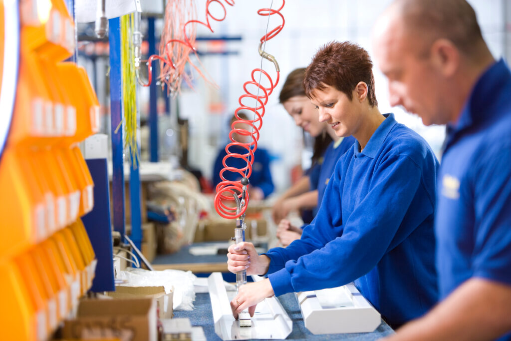 A,medium,shot,of,a,young,female,worker,working,on