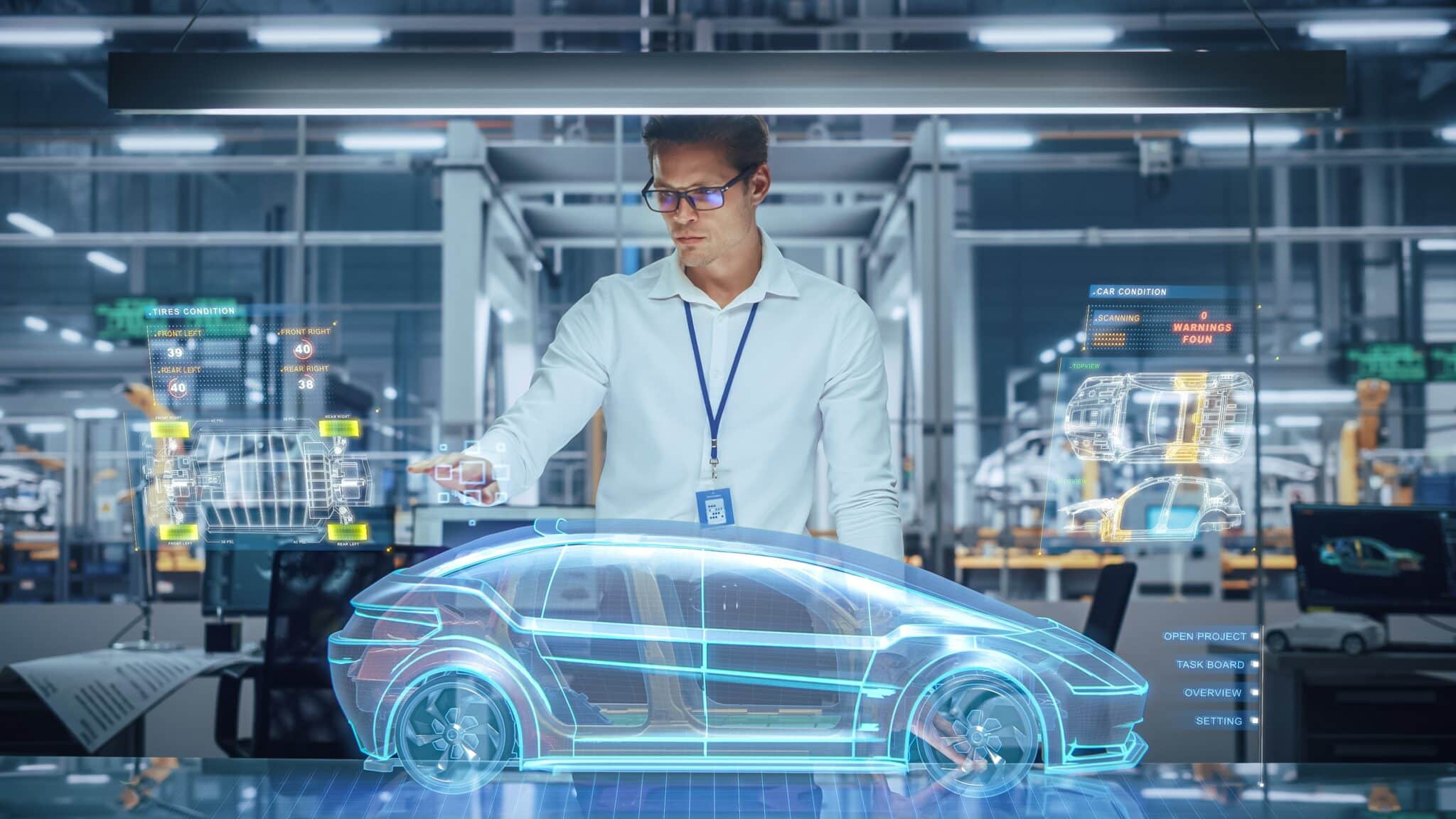 a man in a white shirt is working on a futuristic car