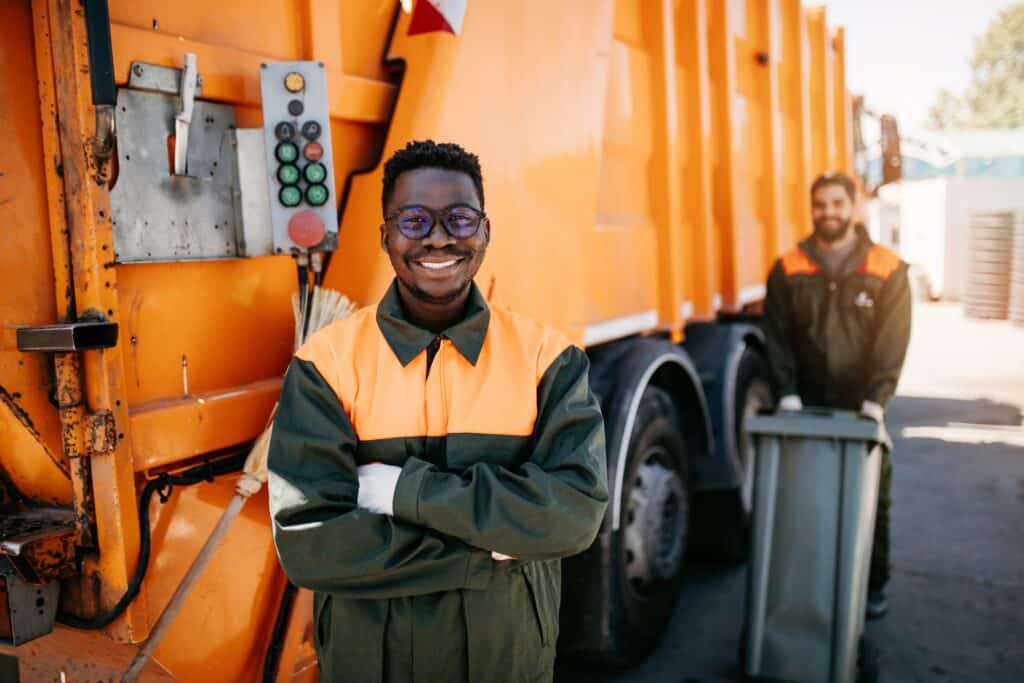 Caucasian,and,black,young,garbage,men,working,together,on,emptying,Labor Solutions