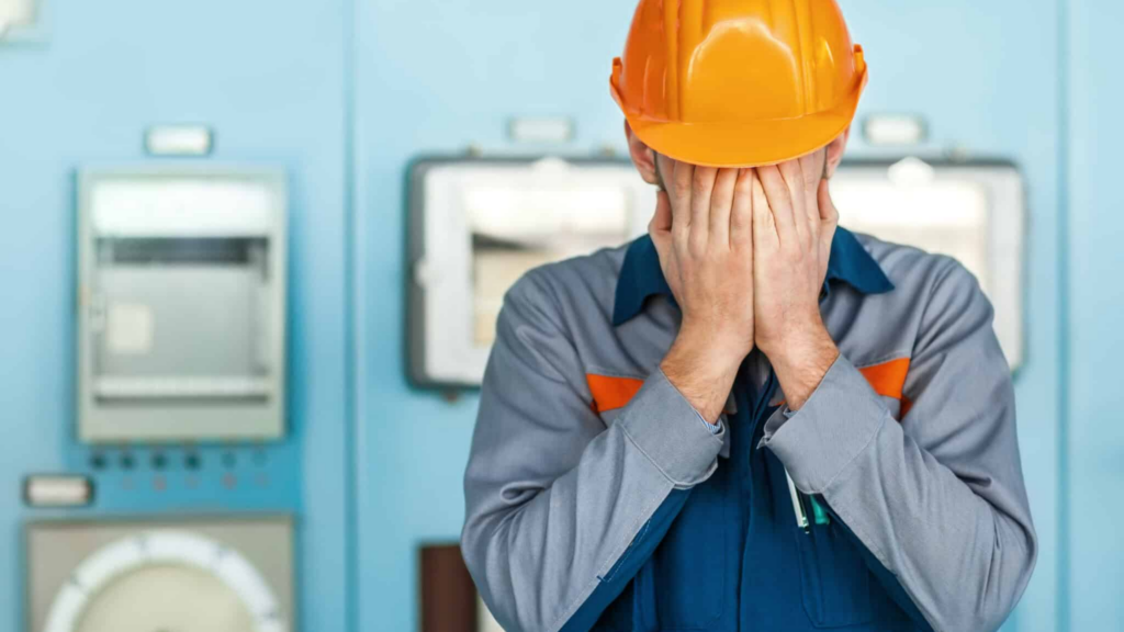 Portrait,of,stressed,despair,engineer,closed,face,by,two,hands,crisis Management