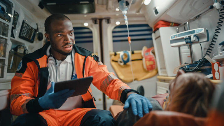 Black,african,american,ems,professional,paramedic,using,tablet,computer,to EMS Scheduling Software