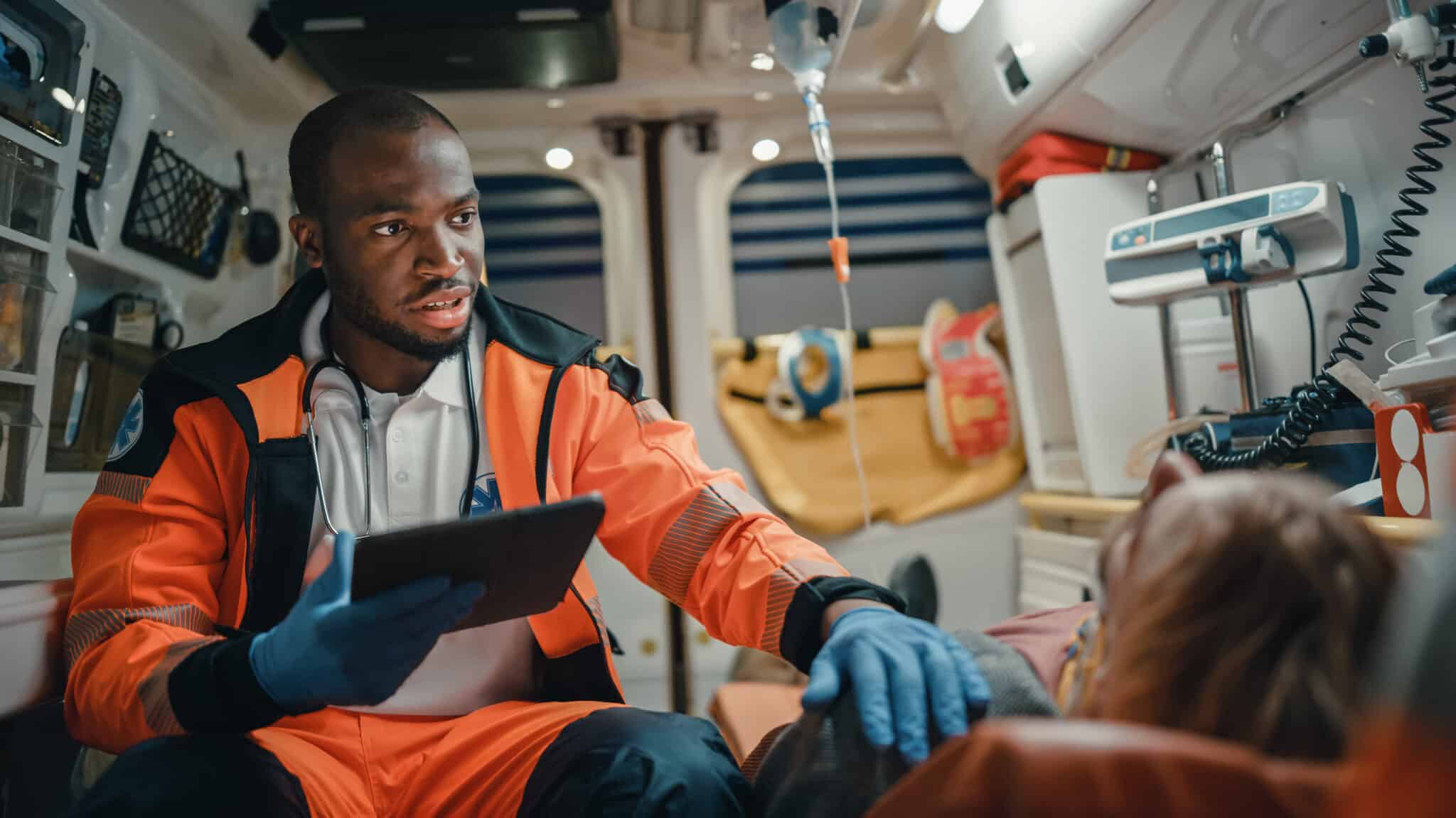 Black,african,american,ems,professional,paramedic,using,tablet,computer,to EMS Scheduling Software