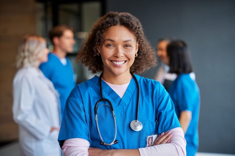 Confident,happy,woman,nurse,smiling,with,crossed,arms,with,healthcare, Nurse Scheduling Software