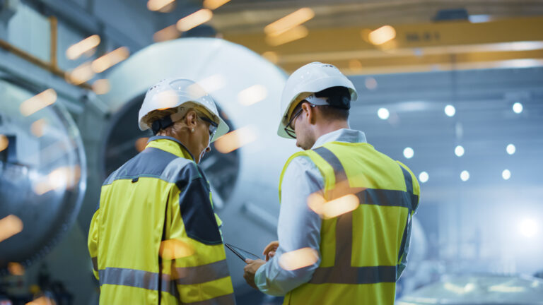 Two,heavy,industry,engineers,stand,in,pipe,manufacturing,factory,,use, Aviation Safety