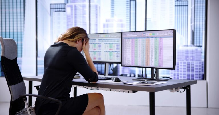 Frustrated,analyst,with,spreadsheet,data,on,screen, frustrated scheduler looking at employee work schedules