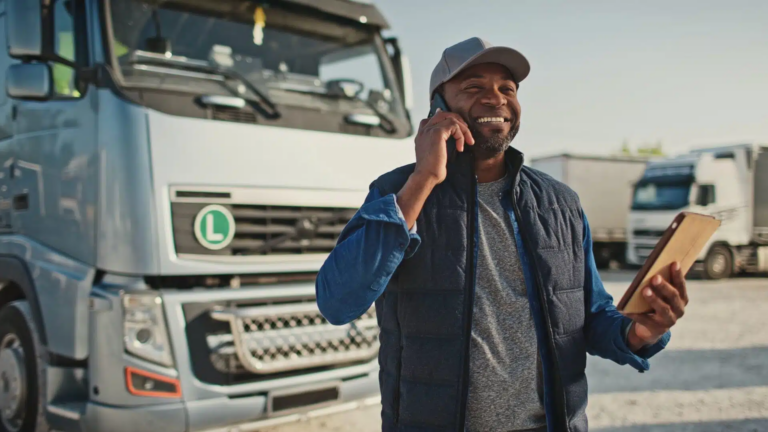 Truck Driver In Front Of Truck; Trucking Kpi Software