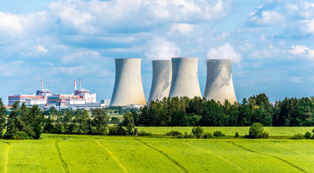 Nuclear,power,plant,on,the,background,of,beautiful,green,summer,Advantages of Nuclear Energy