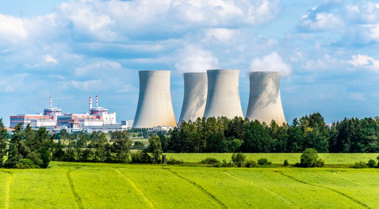 Nuclear,power,plant,on,the,background,of,beautiful,green,summer,Advantages of Nuclear Energy
