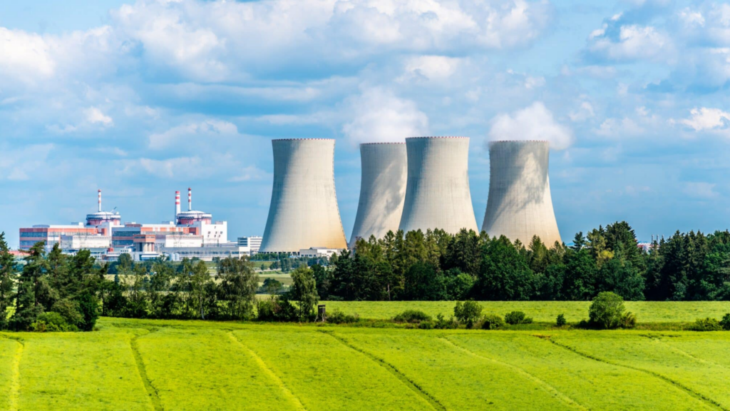 Nuclear,power,plant,on,the,background,of,beautiful,green,summer,advantages Of Nuclear Energy