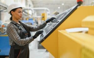Woman Operating Machinery Demonstrating Core Competencies