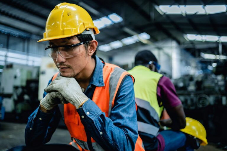 Engineer,or,factory,worker,feeling,tired,from,hard,work,in, backfilling a position