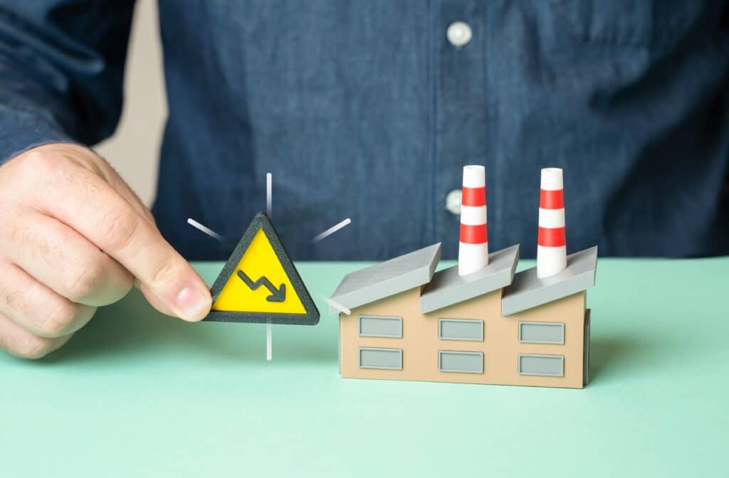 A,man,warns,of,a,drop,in,factory,income.,industrial, workforce reduction