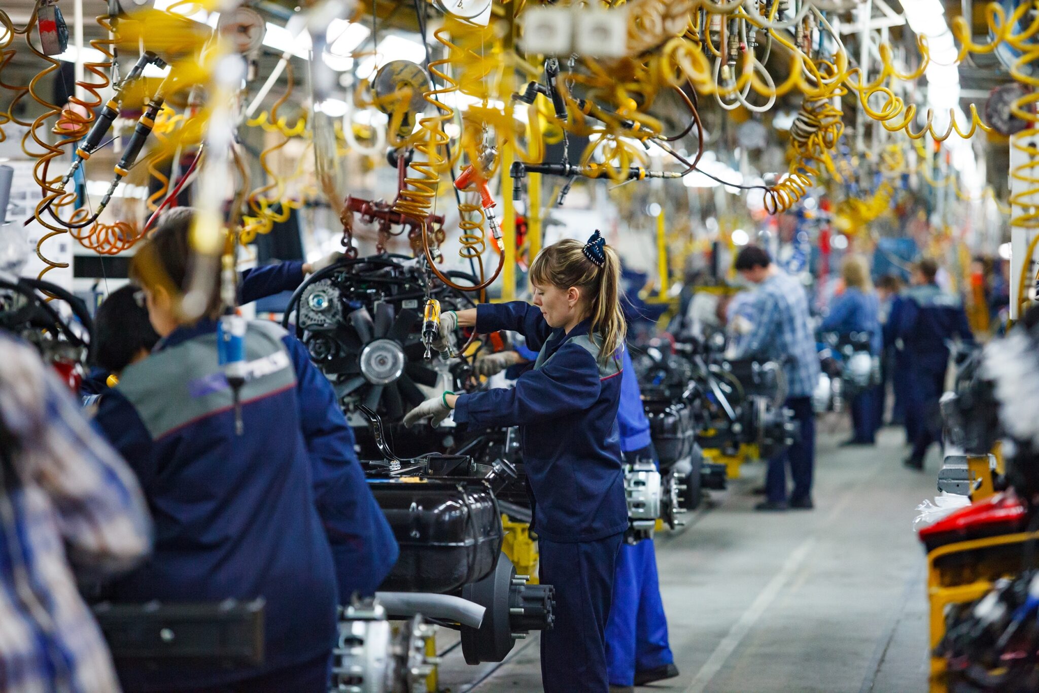 Car assembly line before automation and automotive layoffs