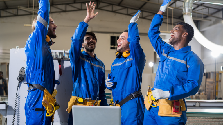 Manufacturing Employee Experience; 4 employees hands in the air