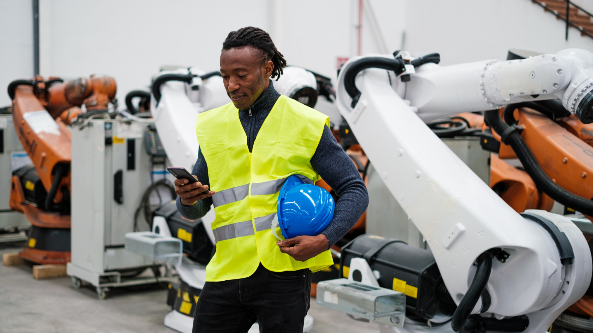 Man, In, Ppe, With, A, Blue, Hardhat, Holding, His, Cellphone