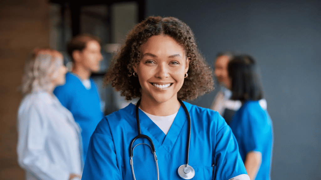 Confident,happy,woman,nurse,smiling,with,crossed,arms,with,healthcare, Nurse Scheduling Software