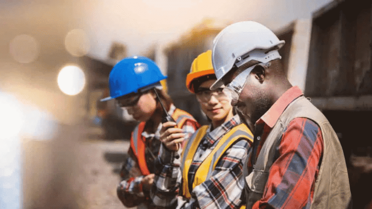 Engineering,team,standing,and,talking,about,work,and,quality,of,work